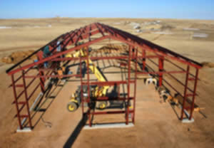 Metal Building shell from above Metal Building being assembled